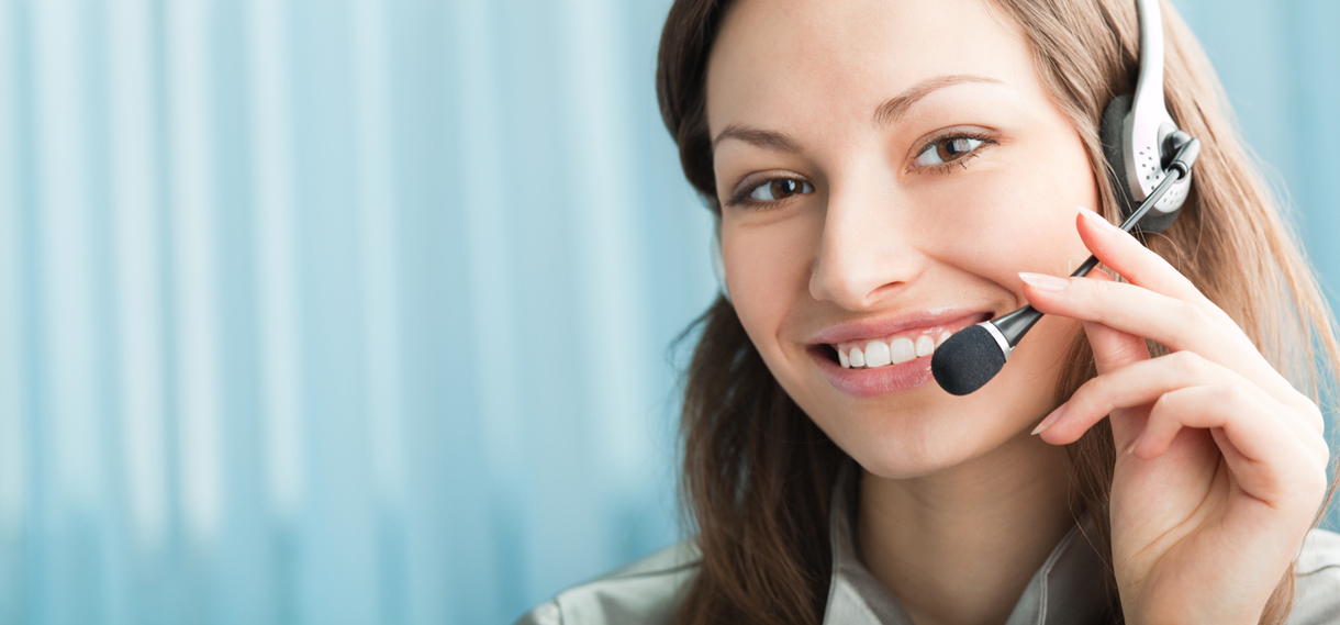 Smiling Client Service Representative talking on phone.