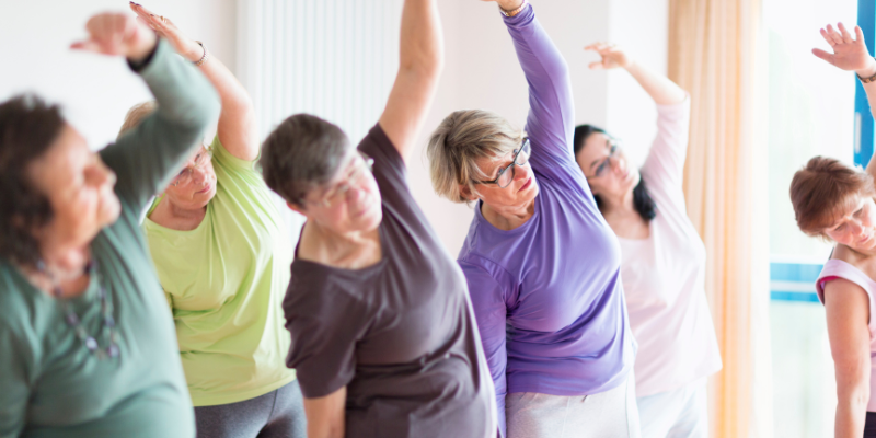 Group of older adults in a yoga class