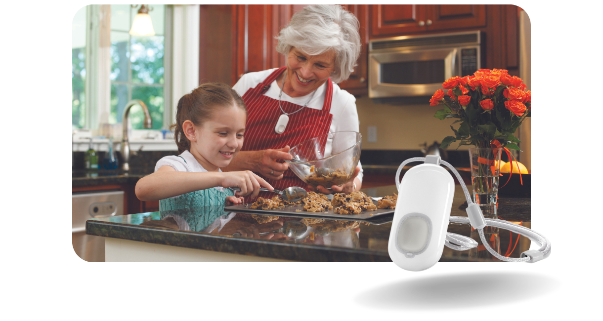 older women with lifeline button and young girl baking