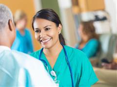 banner-image-08 Female nurse speaking to a patient