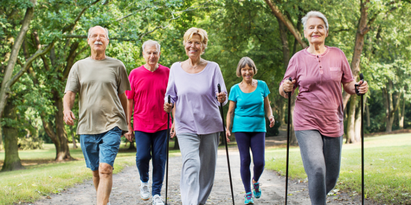 Group of older adults walking together for exercise