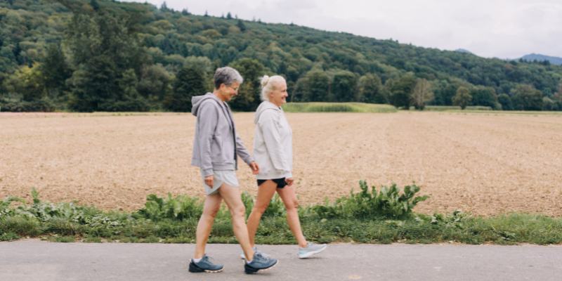 Outdoor activity-walking- Two older women walking together