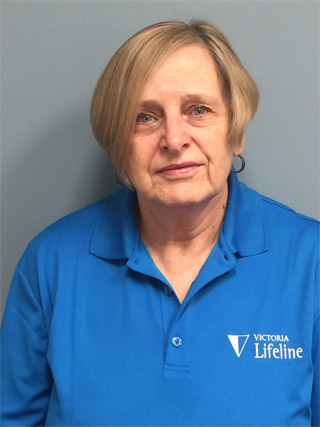 pat-haywood Lifeline volunteer Pat wearing a blue Lifeline shirt.